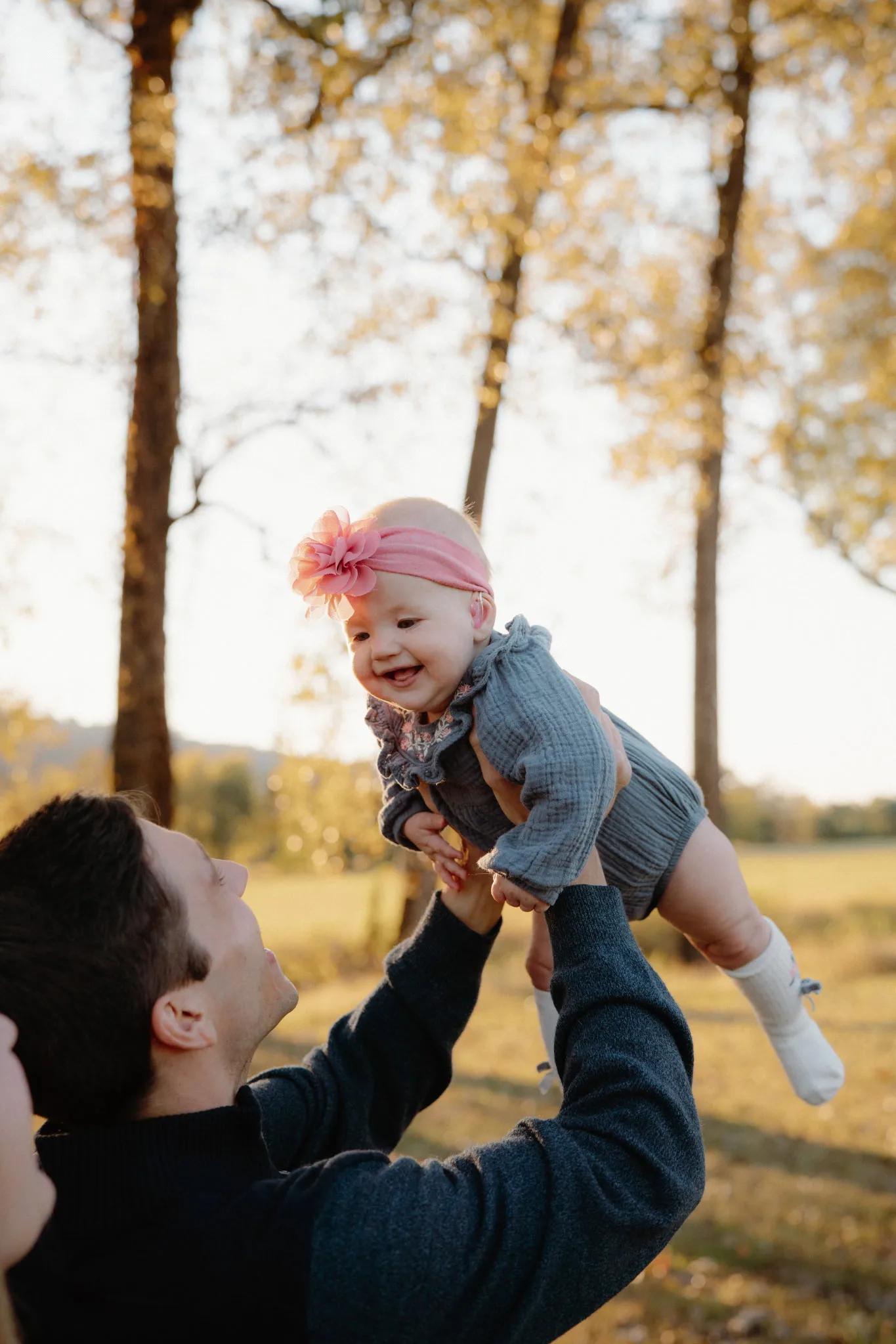 Father lifting his daughter in the air
